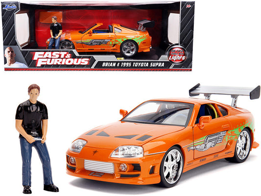 1995 Toyota Supra Orange Metallic With Lights And Brian Figurine Fast & Furious" Movie 1/18 Diecast Model Car By Jada"""
